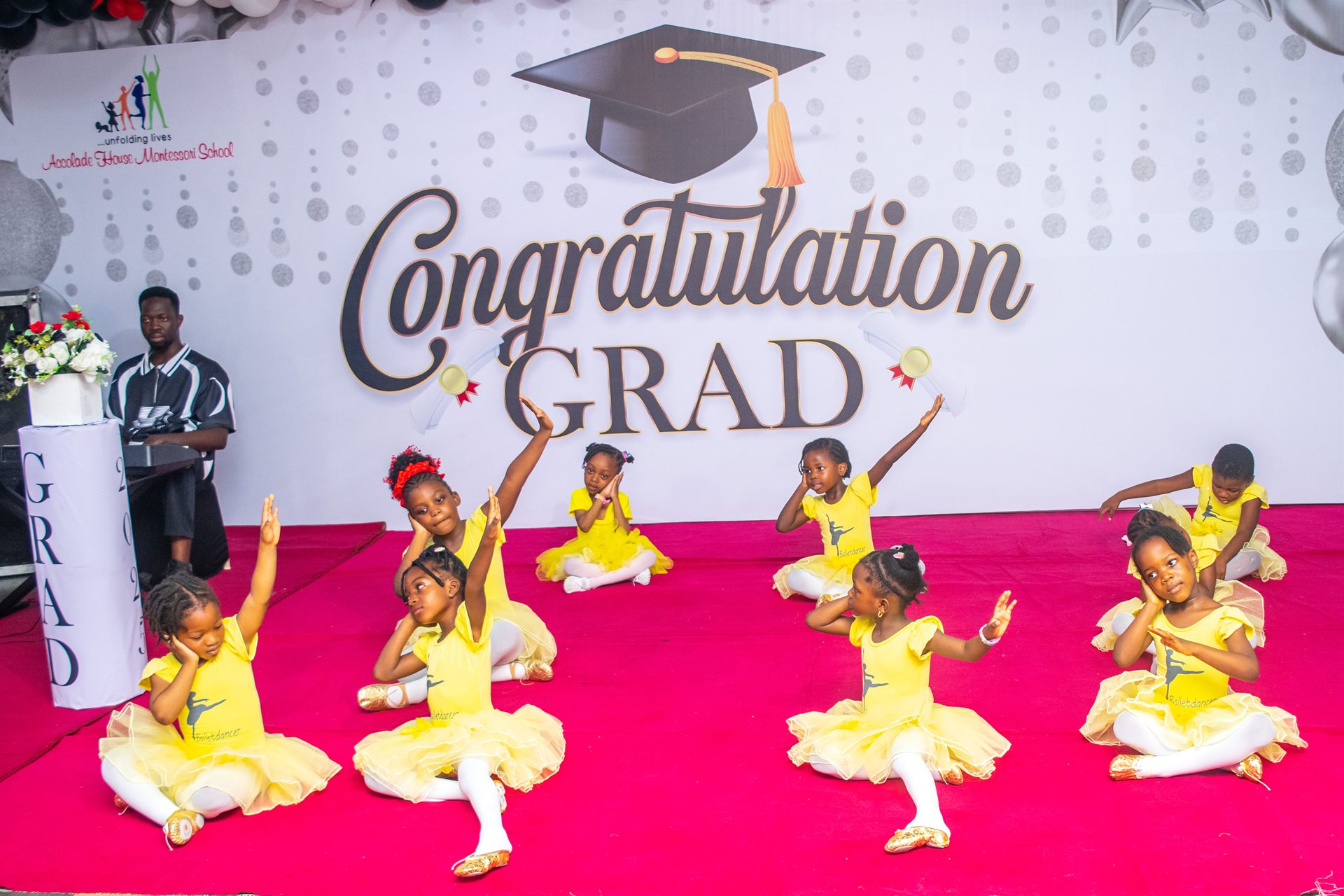 Pupils performing a ballet routine on the graduation stage