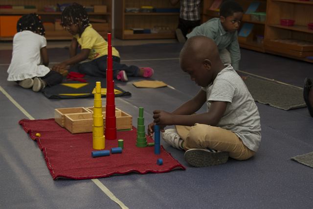 Pupils with Montessori knobless cylinders